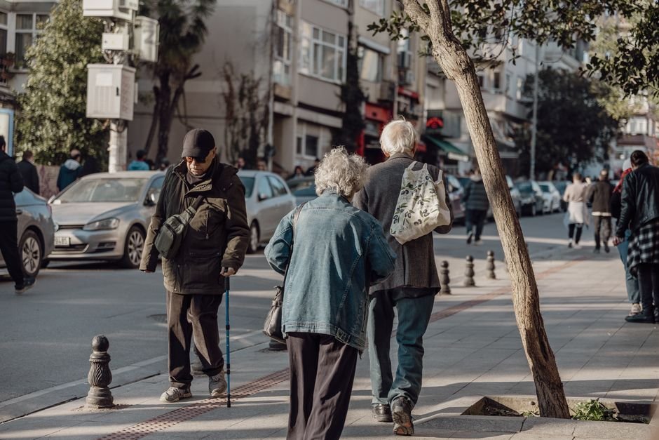 Elderly couple walking together outdoors safely