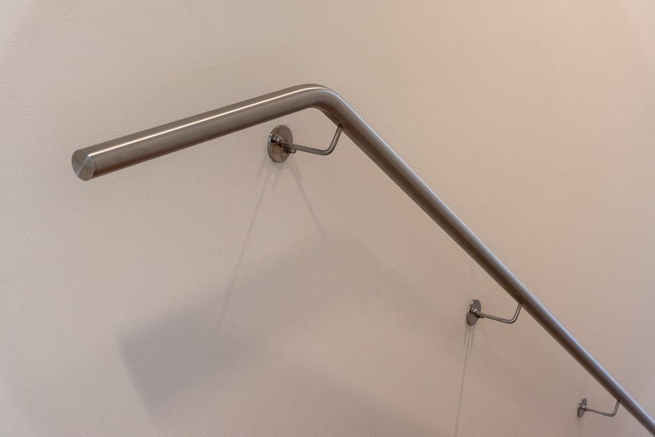 Grab bar mounted on bathroom wall