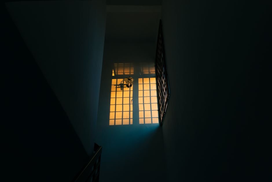 Dimly lit home hallway at night