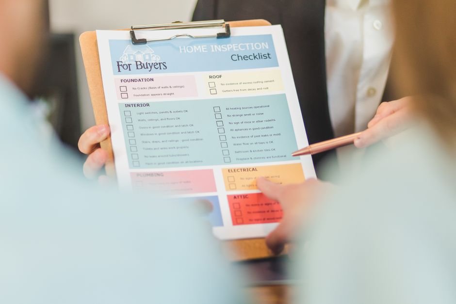 Hands holding a home safety checklist