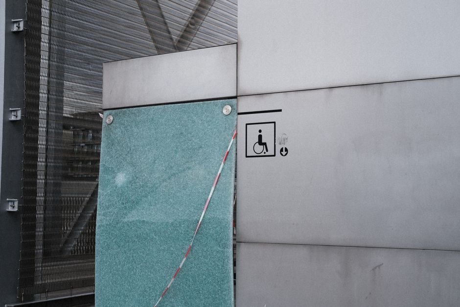 Building entrance with wheelchair accessibility symbol